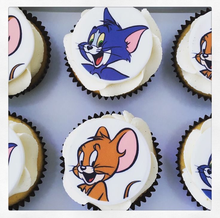 Cupcakes topped with round edible printed cartoon cat-and-mouse images