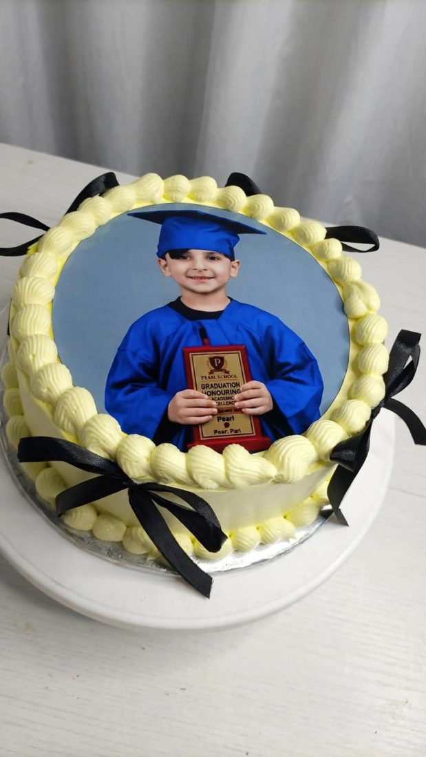 Photo cake with an edible printed picture on white frosting
